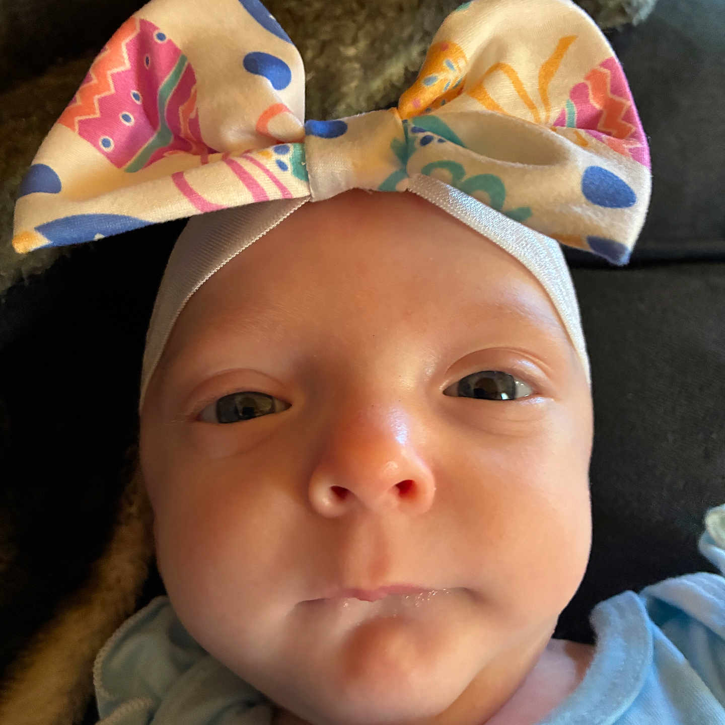 Maci Kay York is registered to the contest to win money with this photo: baby, infant, headband, bow, face, eyes, clothing, portrait, closeup, cute, child, newborn, soft_light, indoors, person, skin, expression, apparel, young, headwear