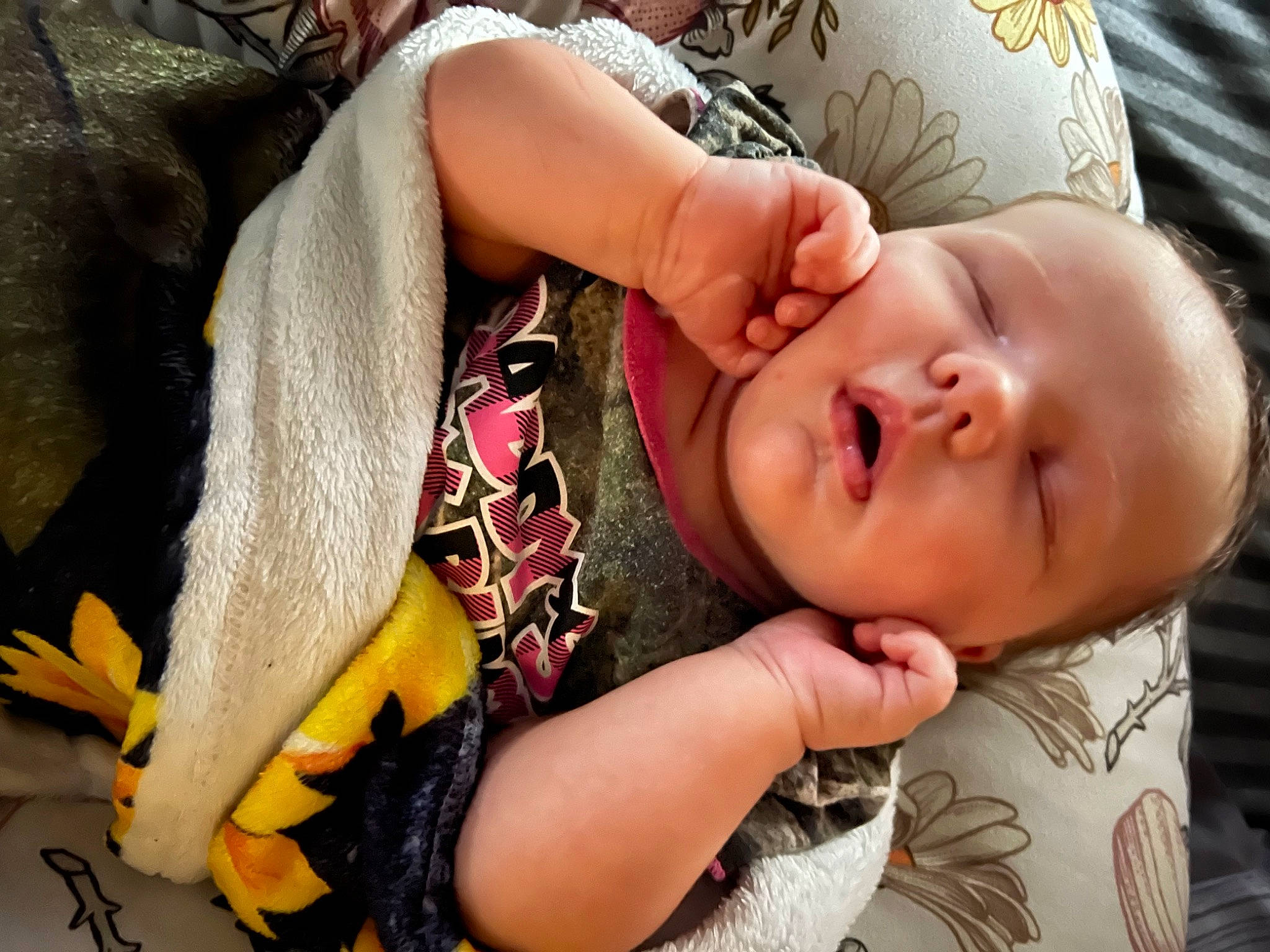 Leah is registered to the contest to win money with this photo: arm, baby, baby_toddler_clothing, cheek, comfort, eye, eyelash, finger, gesture, hand, happy, human_body, iris, lip, mouth, nail, neck, nose, person, skin