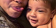 Isaias joined the competition — help win amazing prizes! woman, baby, child, face, smile, tongue, playful, indoor, portrait, skin, hair, closeup, expression, person, happy, cute, family, affection, love, holding