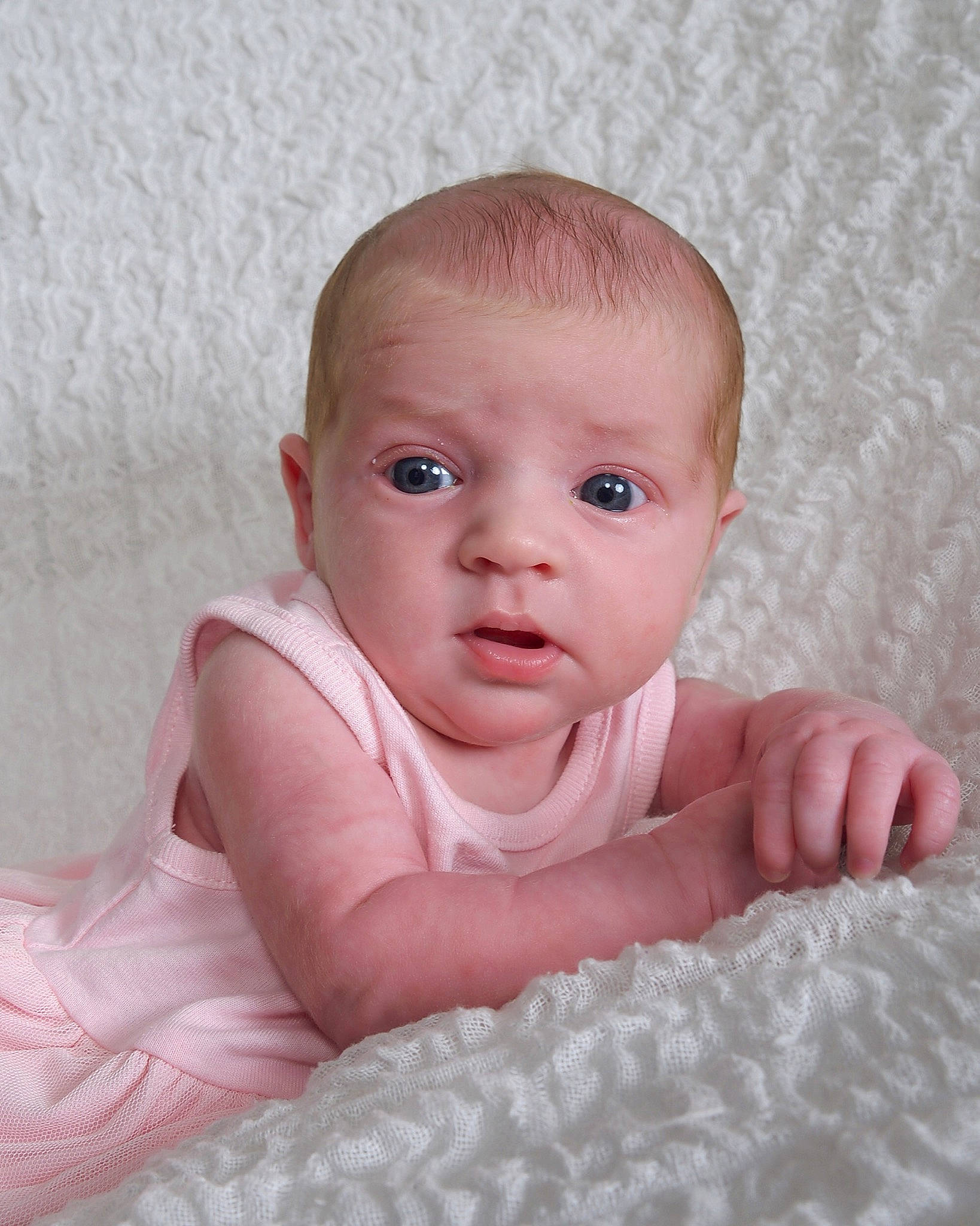 Arizona joined the competition — help win amazing prizes! baby, cheek, child, chin, eye, face, finger, hand, head, iris, lip, mouth, nose, person, pink, portrait_photography, sitting, skin, toddler