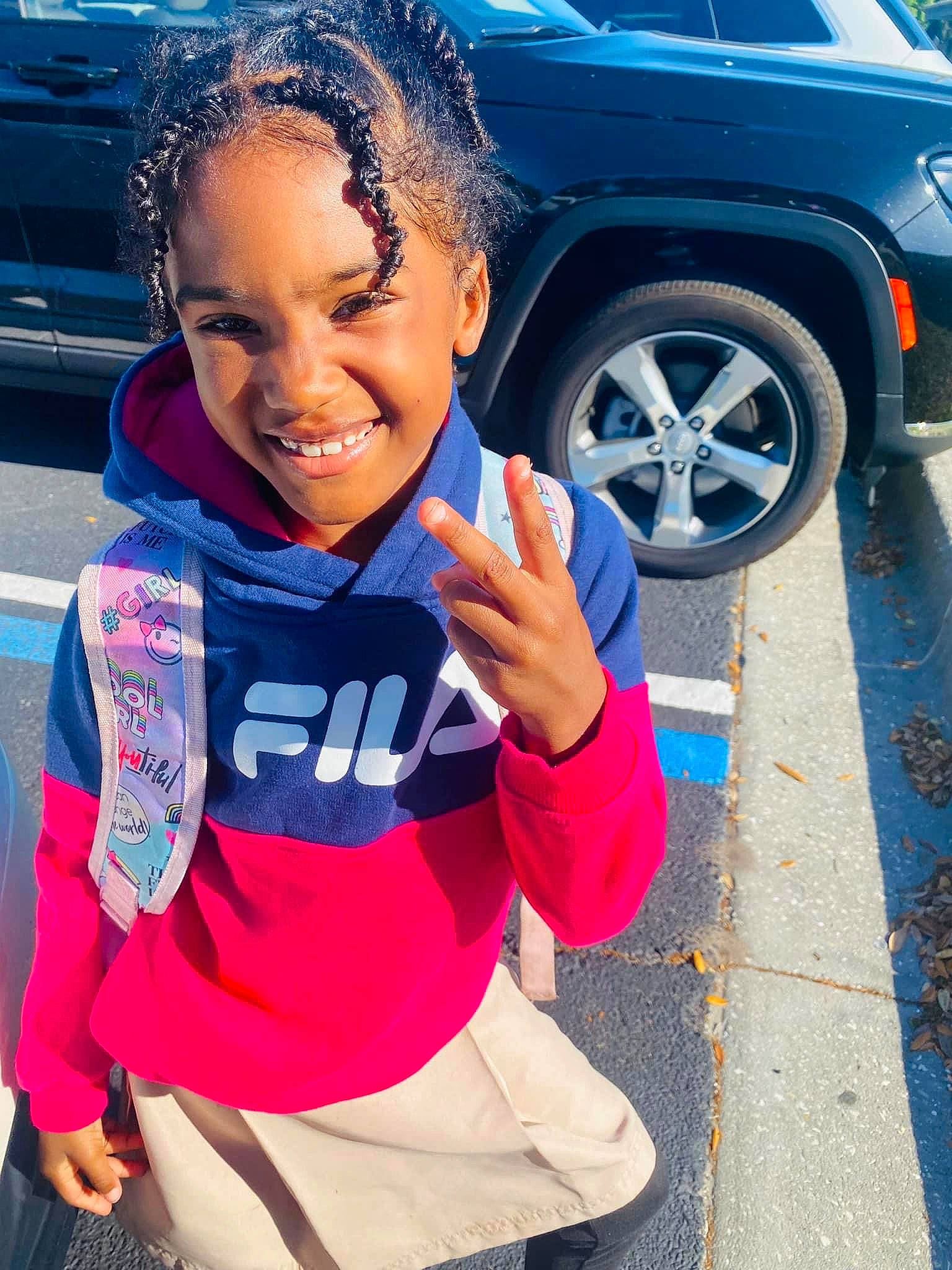 Brielle joined the competition — help win amazing prizes! alloy_wheel, automotive_design, automotive_exterior, automotive_lighting, automotive_tire, blue, car, cool, electric_blue, happy, joy, land_vehicle, motor_vehicle, person, rim, sleeve, smile, sportswear, tire, vehicle