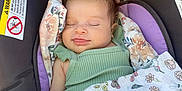 Mila is registered to the contest to win money with this photo: baby, bed, blanket, clothing, crib, cushion, face, furniture, happy, head, homedecor, infantbed, newborn, person, photography, portrait, quilt, sleeping, smile, t_shirt