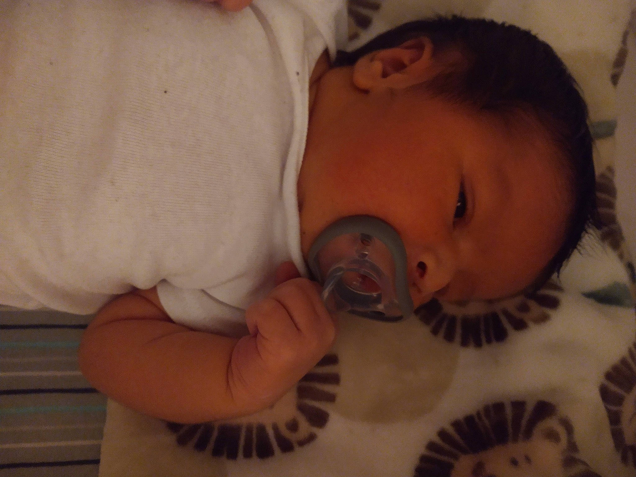 Alan is registered to the contest to win money with this photo: baby, baby_toddler_clothing, cheek, chin, comfort, ear, eye, eyebrow, facial_expression, finger, hair, human_body, iris, lip, mouth, neck, nose, person, skin, textile