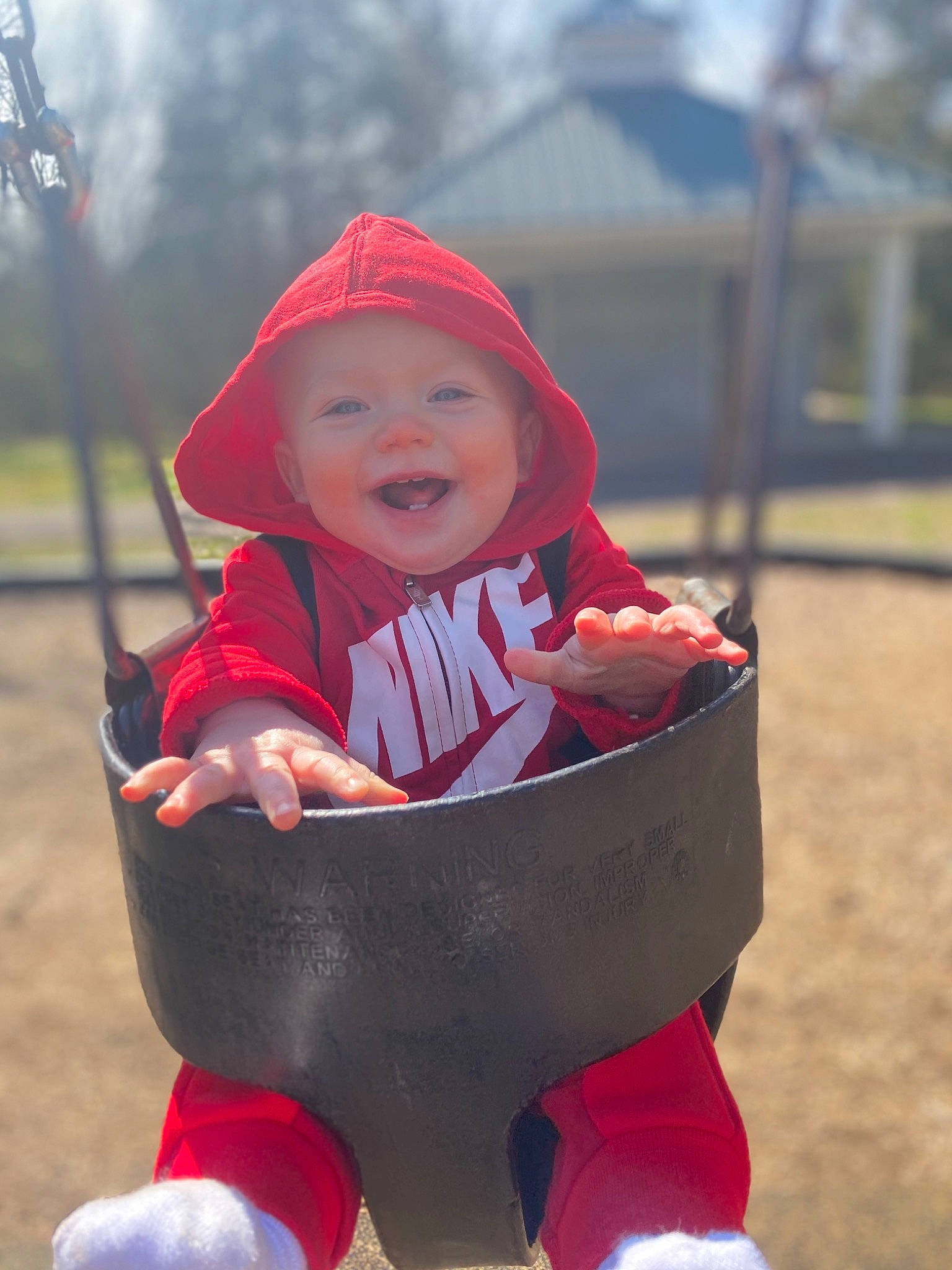 Natalee is registered to the contest to win money with this photo: baby, baby_products, baby_toddler_clothing, cap, child, face, fun, grass, happy, headgear, headwear, leisure, outerwear, people_in_nature, person, personal_protective_equipment, recreation, sitting, sleeve, smile