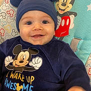 Djibrîl participe au concours pour gagner de l'argent avec cette photo : baby, child, smiling, blue_hat, mickey_mouse, baby_seat, colorful, cute, happy, clothing, pattern, indoor, toddler, face, headwear, playful, seated, straps, infant, cartoon_character