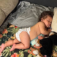 Ezekiel joined the competition — help win amazing prizes! baby, blanket, bottle, child, clothing, couch, diaper, face, furniture, hair, nap, person, plush_toy, pillow, sleeping, toddler, toy, indoors, rest, skin