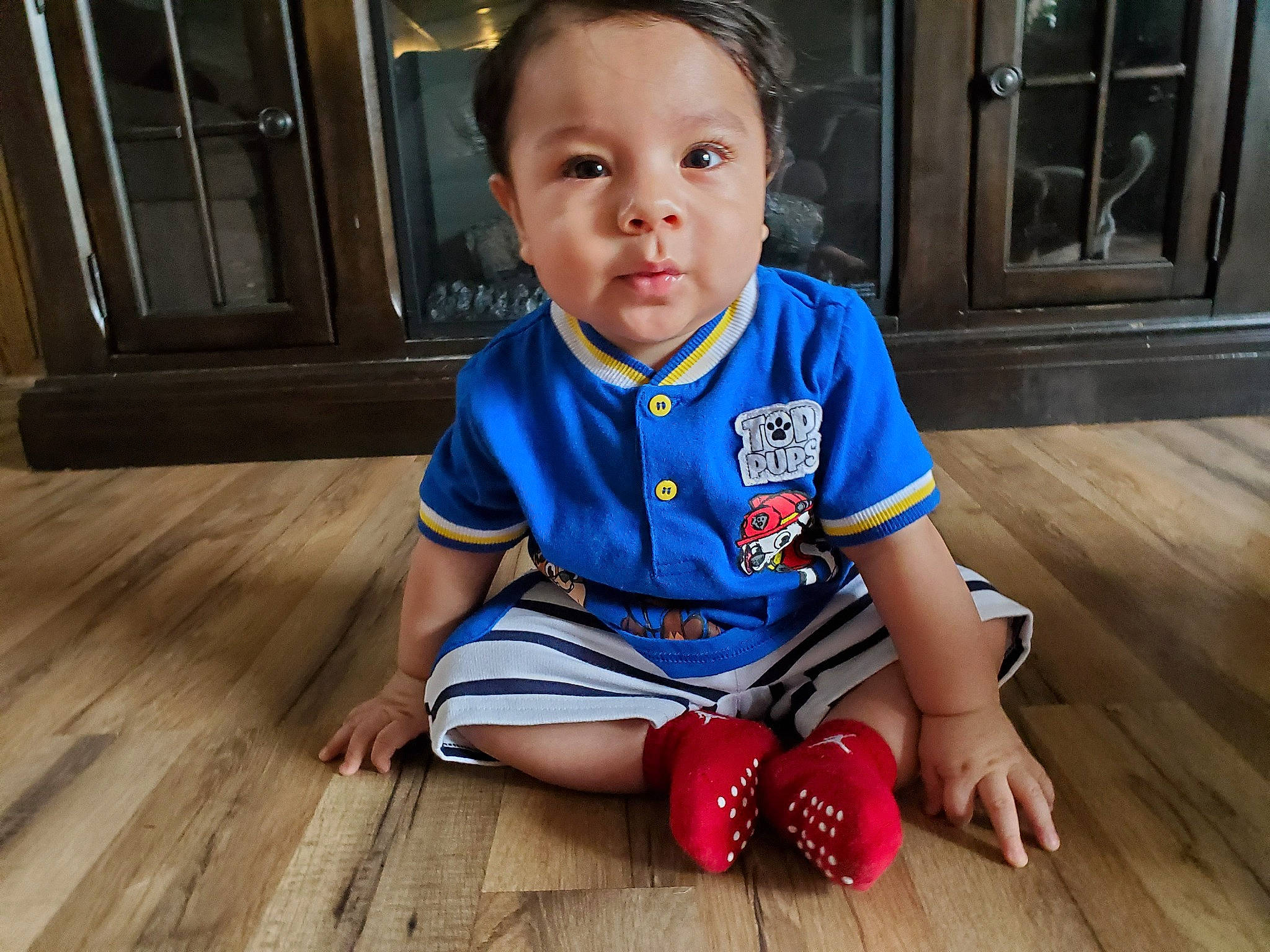 Ulysses joined the competition — help win amazing prizes! baby, blue, cheek, child, child_model, floor, flooring, hardwood, person, play, sitting, skin, smile, toddler, wood, wood_flooring