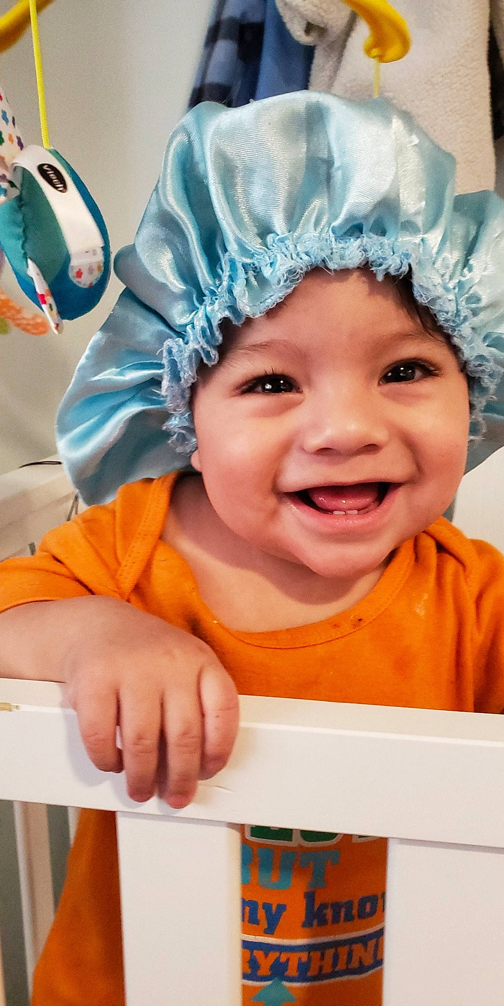 Ulysses joined the competition — help win amazing prizes! baby, child, costume, facial_expression, happy, head, headgear, headwear, joy, laugh, person, room, shower_cap, smile, toddler