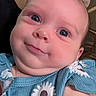 Aurora is registered to the contest to win money with this photo: baby, child, face, blue_eyes, smile, clothing, blue_dress, daisy_pattern, closeup, infant, cute, portrait, skin, head, young_child, person, indoors, happy, cheeks, expression