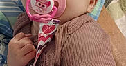 Aurora joined the competition — help win amazing prizes! baby, pacifier, infant, hand, blanket, clothing, cute, face, person, child, sleepwear, indoors, skin, expression, newborn, comfort, resting, closeup, holding, young