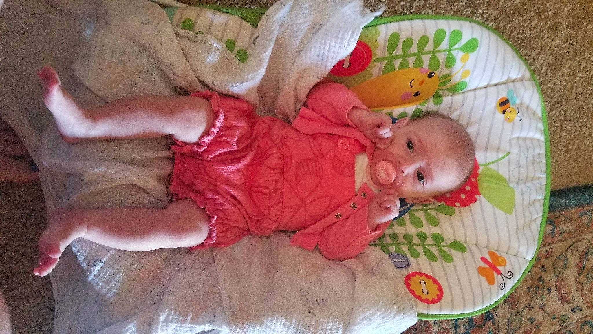Hannah is registered to the contest to win money with this photo: baby, baby_products, baby_toddler_clothing, baby_toys, bed, bedtime, cheek, child, comfort, happy, linens, mammal, pattern, person, pink, room, skin, sleep, sock, toddler