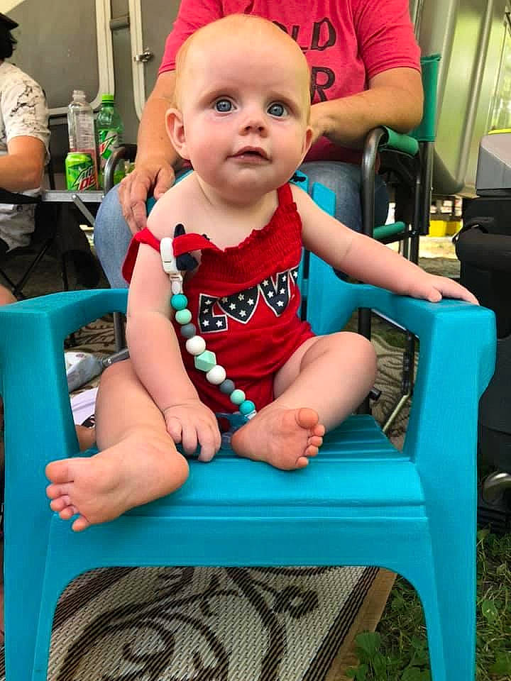 Porter is registered to the contest to win money with this photo: baby, chair, child, furniture, person, play, sitting, toddler, turquoise