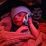 Anthony is registered to the contest to win money with this photo: baby, beanie, bed, blanket, bonnet, cap, clothing, couch, face, furniture, glove, hat, head, newborn, person, photography, portrait, quilt, sleeping, towel