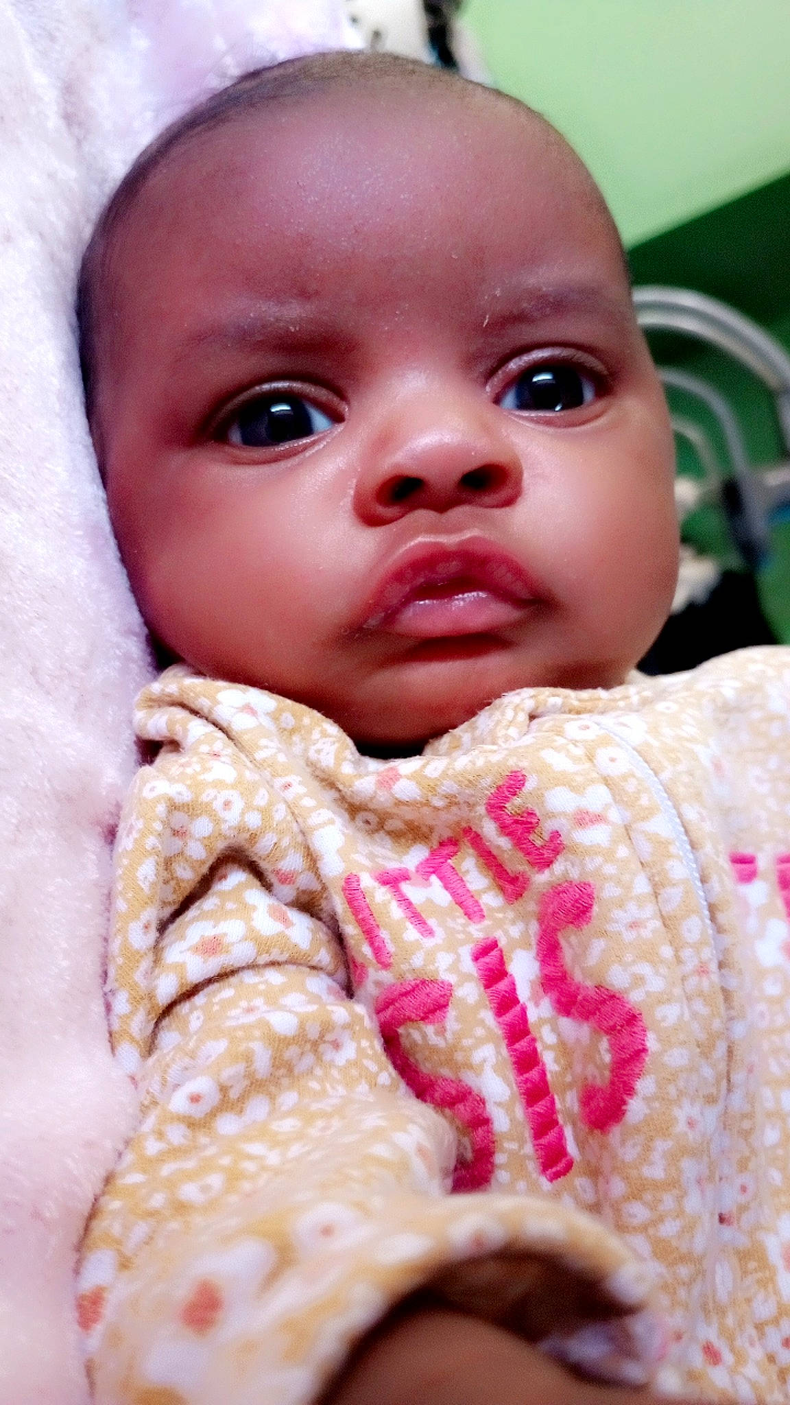 Alana is registered to the contest to win money with this photo: baby, baby_toddler_clothing, cheek, child, chin, eyebrow, eyelash, facial_expression, happy, iris, linens, lip, mouth, nail, neck, nose, peach, person, pink, skin