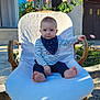 Alessio participe au concours pour gagner de l'argent avec cette photo : baby, child, outdoor, chair, flower, pink_roses, cushion, sunlight, face, head, foot, clothing, striped_shirt, bandana, garden, plants, wood, window, building, portrait