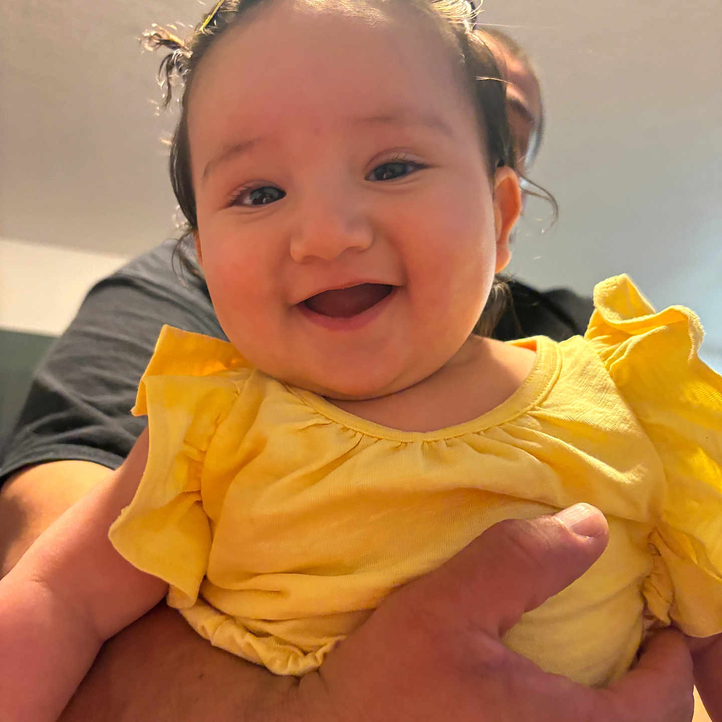 Anaya Rose is registered to the contest to win money with this photo: baby, child, smile, happy, yellow_clothing, person, hand, tattoo, indoor, portrait, cute, infant, holding, face, skin, expression, young_child, toddler, bright, joy