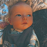 Colson joined the competition — help win amazing prizes! baby, infant, child, bedding, blanket, pattern, clothing, sleepwear, face, portrait, hand, lying_down, indoor, soft_lighting, cute, peaceful, young, skin, expression, warm