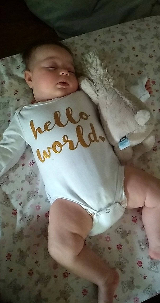 Korra joined the competition — help win amazing prizes! baby, baby_toddler_clothing, chest, child, comfort, eye, face, finger, head, human_leg, joint, linens, neck, pattern, person, pink, skin, sleeve, t_shirt, thigh