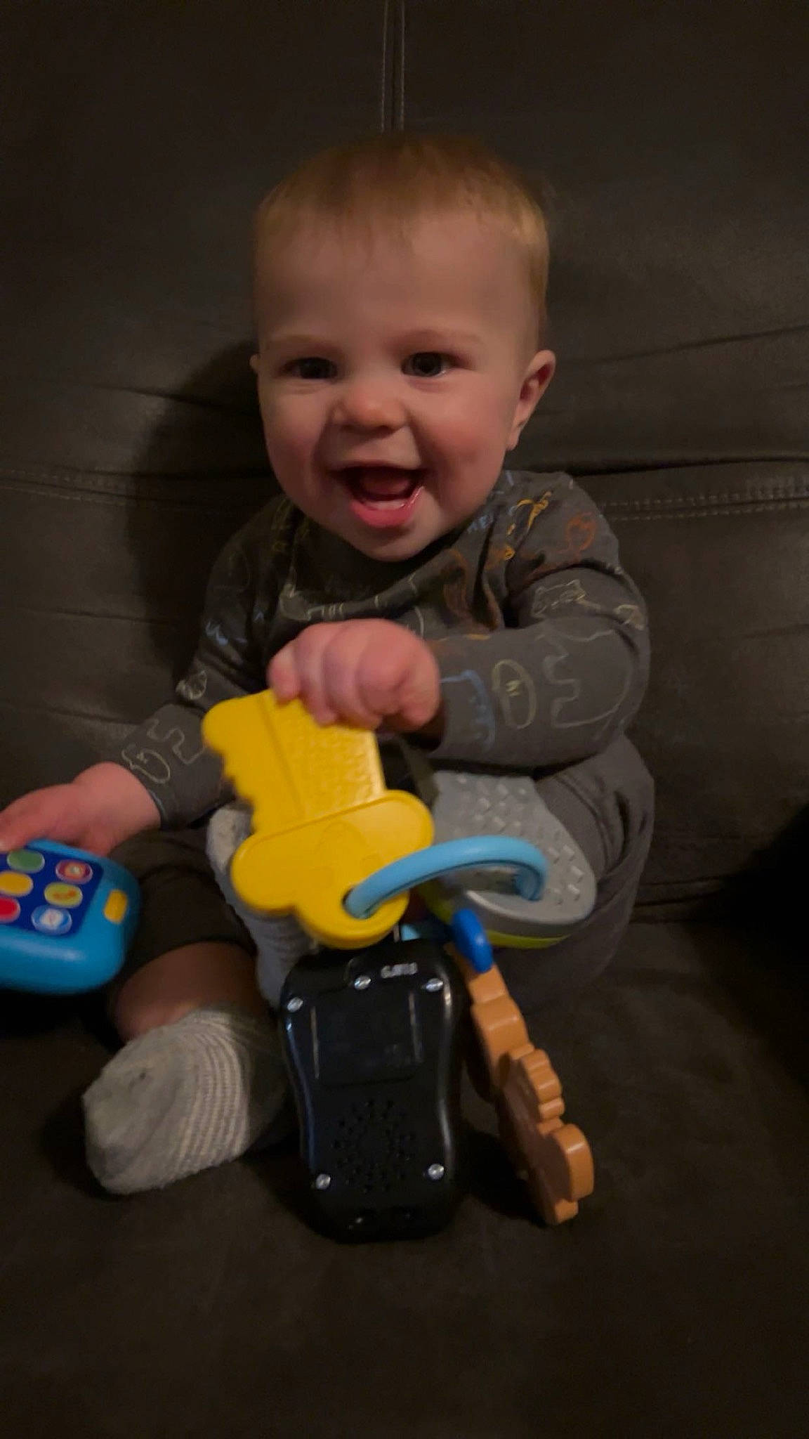 Asher is registered to the contest to win money with this photo: baby, baby_playing_with_toys, baby_products, baby_toddler_clothing, cheek, child, finger, fun, hand, joy, nose, organ, person, riding_toy, sitting, skin, sleeve, smile, standing, thumb