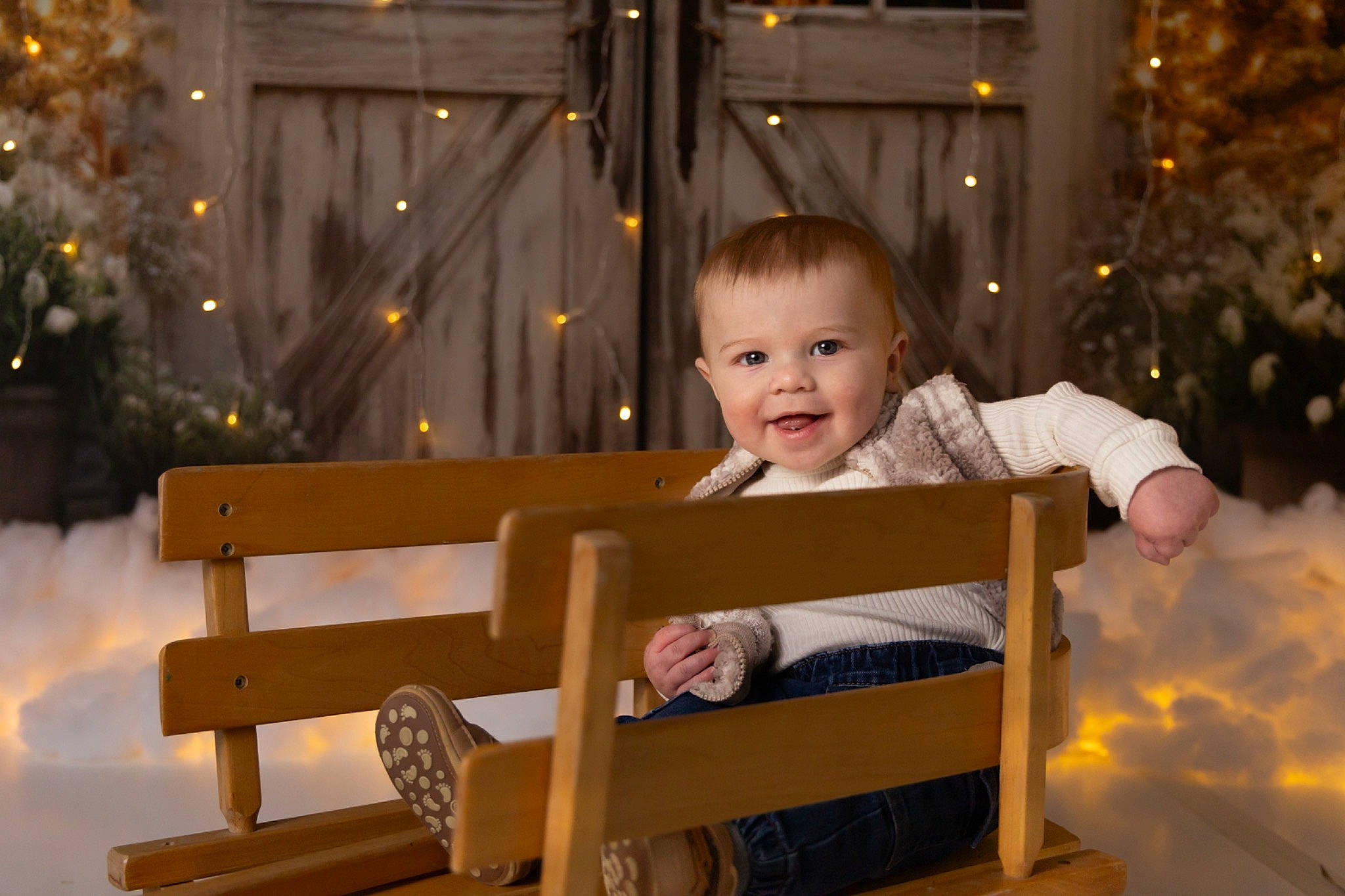 Asher is registered to the contest to win money with this photo: baby, baby_toddler_clothing, bench, child, christmas, christmas_decoration, event, face, fun, happy, holiday, joy, leisure, outdoor_bench, outdoor_furniture, person, sitting, smile, toddler, tree