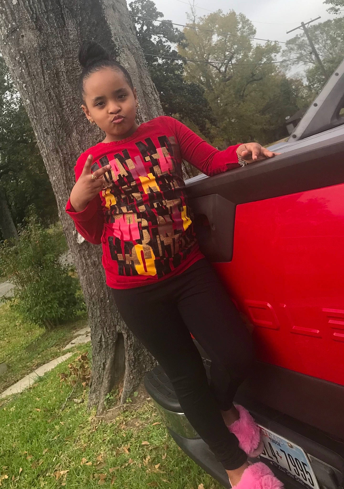 Tymirah joined the competition — help win amazing prizes! automotive_exterior, automotive_lighting, automotive_tire, beauty, bumper, fender, grass, happy, hood, leisure, motor_vehicle, person, plant, shoe, sneakers, t_shirt, tints_and_shades, tire, toddler, tree