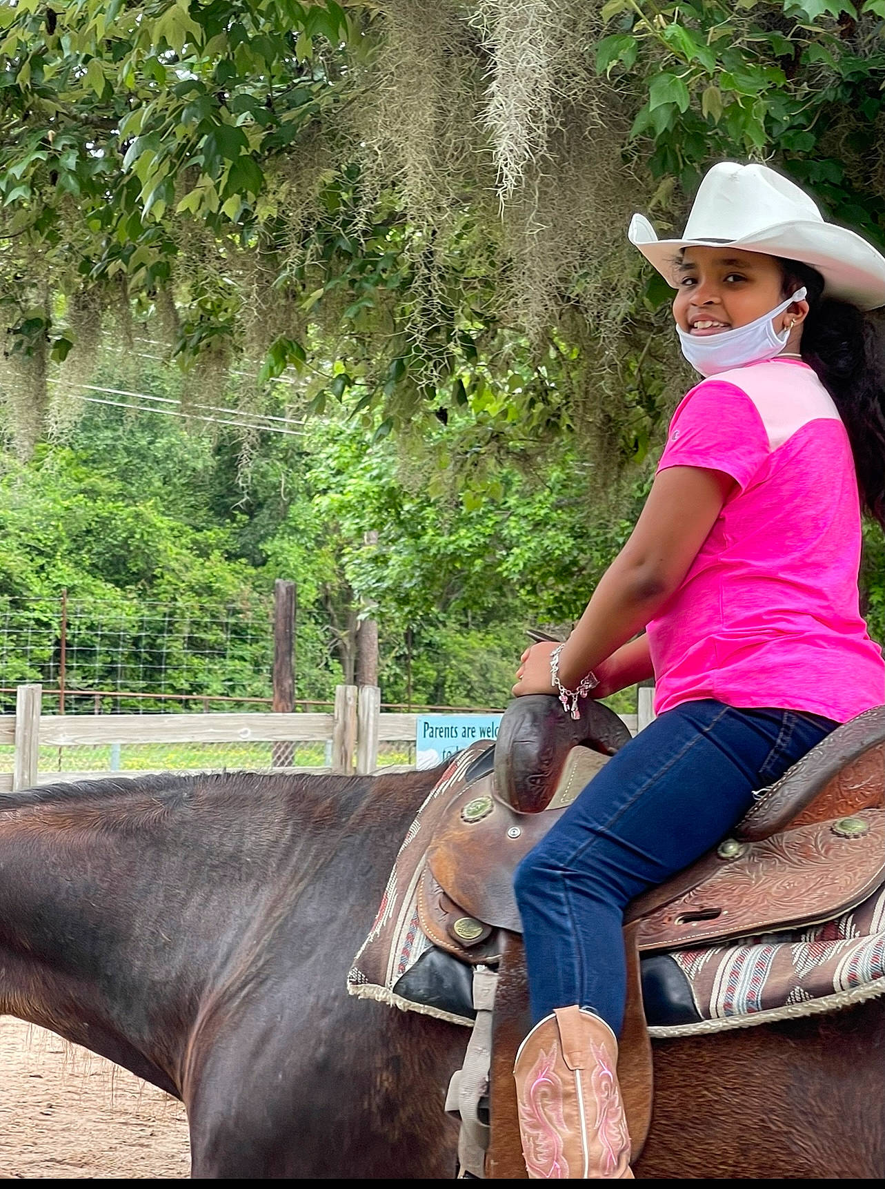 Tymirah is registered to the contest to win money with this photo: bridle, grass, green, happy, hat, headwear, helmet, horse, horse_supplies, horse_tack, leisure, mammal, person, plant, rein, saddle, sun_hat, sunglasses, travel, tree