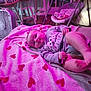 Aurora joined the competition — help win amazing prizes! baby, blanket, heart_pattern, clothing, indoor, floor, chair, fan, baby_bouncer, person, cute, infant, relaxing, purple_light, wooden_floor, furniture, cozy, smiling, toddler, portrait