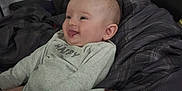 Aurora joined the competition — help win amazing prizes! baby, bed, bedding, blanket, clothing, cozy, cute, face, happy, headboard, indoor, infant, monkey_print, onesie, person, resting, skin, smiling, tongue_out, young_child
