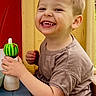 Oakley is registered to the contest to win money with this photo: child, toddler, smiling, happy, toy, playground, shorts, tshirt, indoor, face, hands, sitting, play, cute, young, fun, joyful, childhood, innocent, expression