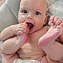 Stella joined the competition — help win amazing prizes! baby, infant, diaper, barefoot, cute, chewing, toes, cushion, seat, animal_print, skin, chubby, happy, wide_eyes, indoor, child, person, closeup, playful, smiling