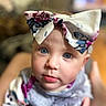 Rynli is registered to the contest to win money with this photo: baby, child, face, blue_eyes, bow, headband, close_up, portrait, cute, infant, apparel, clothing, soft_focus, indoor, person, skin, expression, young, adorable, looking