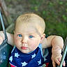 Rynli is registered to the contest to win money with this photo: baby, child, blue_eyes, swing, outdoor, patriotic_clothing, stars, stripes, cute, portrait, infant, summer, playground, scratched_arm, closeup, person, casual, daylight, expression, seat