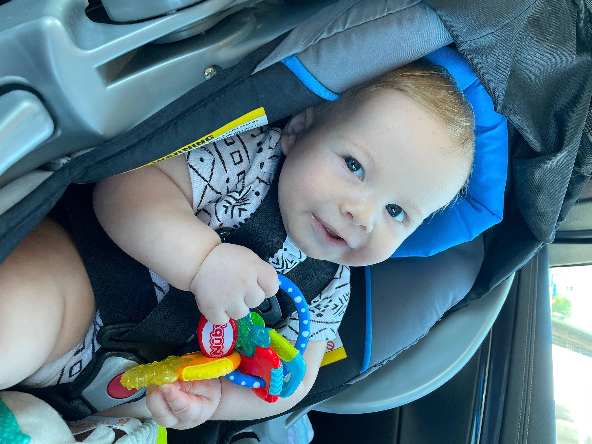 Arthur is registered to the contest to win money with this photo: baby, baby_carriage, baby_products, baby_safety, baby_toddler_clothing, blue, cheek, child, comfort, electric_blue, eye, face, facial_expression, happy, iris, person, skin, smile, thumb, toddler