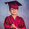 Israel joined the competition — help win amazing prizes! child, young_graduate, graduation, cap, gown, diploma, portrait, smiling, standing, indoors, studio, formalwear, magenta, school, education, ceremony, photography, face, hands, background