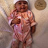 baby, infant, child, smiling, portrait, pink_outfit, onesie, hat, animal_print, lying_down, blanket, cozy, nursery, milestone, plaque, four_months, indoor, cute, happy, photography