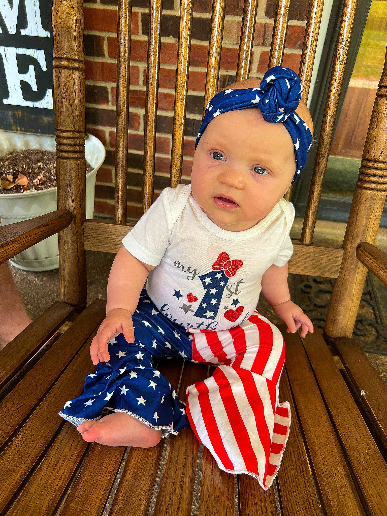 Willadean is registered to the contest to win money with this photo: baby, baby_toddler_clothing, child, design, electric_blue, floor, flooring, foot, fun, happy, hardwood, head, headwear, pattern, person, product, sitting, sleeve, t_shirt, toddler