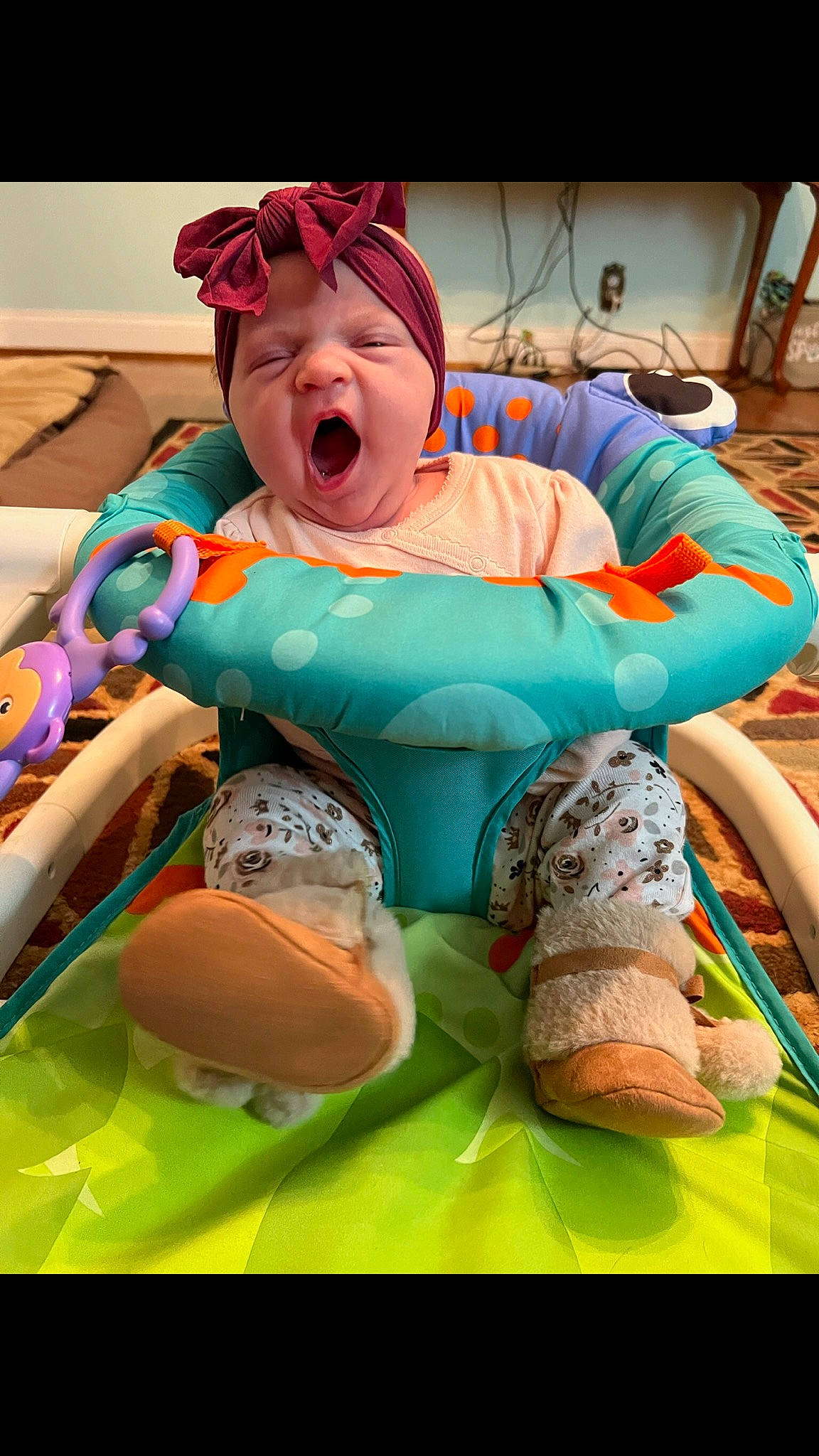 Willadean is registered to the contest to win money with this photo: arm, baby, child, comfort, event, eyewear, fun, happy, human_leg, knee, leisure, mouth, muscle, person, personal_protective_equipment, recreation, sitting, sock, textile, thigh