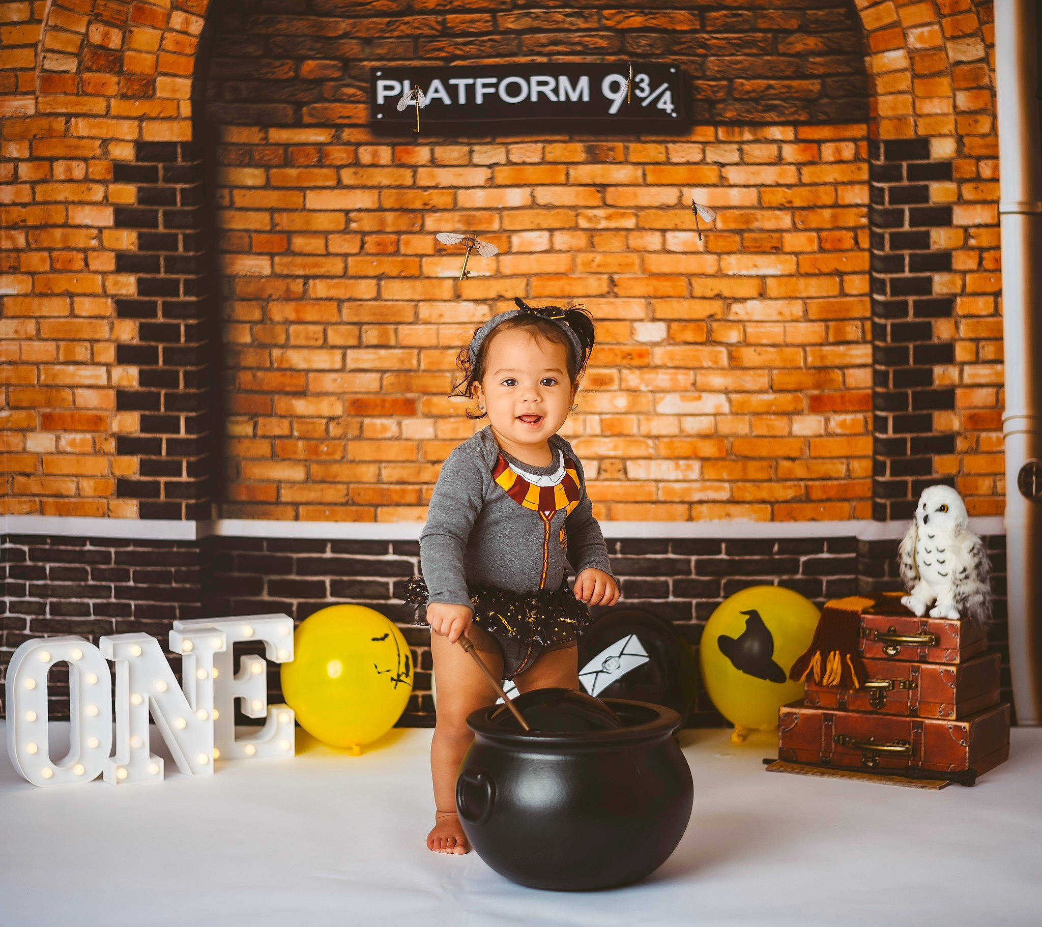 Charlie is registered to the contest to win money with this photo: ball, brick, brickwork, child, flooring, font, fun, happy, leisure, orange, person, personal_protective_equipment, physical_fitness, play, recreation, room, sitting, smile, toddler, wood