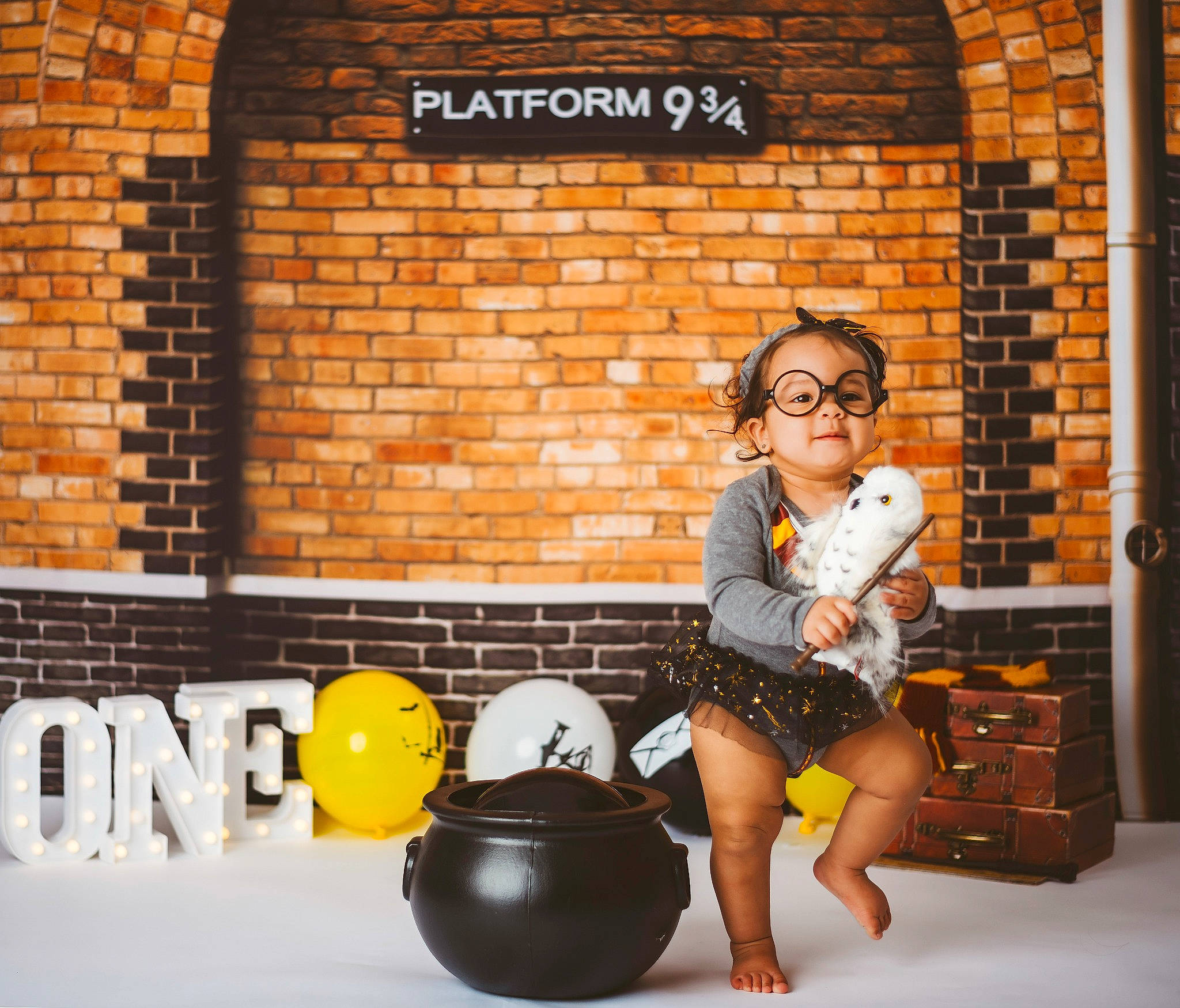 Charlie is registered to the contest to win money with this photo: bag, ball, brick, brickwork, child, eyewear, flash_photography, flooring, fun, happy, leisure, luggage_and_bags, orange, person, photograph, portrait_photography, room, sandal, sitting, snapshot