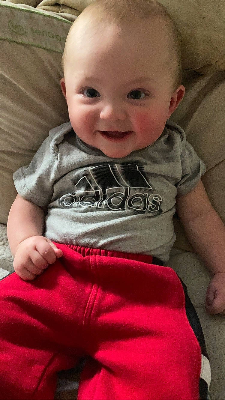 Jalen is registered to the contest to win money with this photo: arm, cheek, chin, comfort, eye, eyebrow, face, facial_expression, hair, hairstyle, hand, head, joy, leg, lip, mouth, nose, organ, person, product