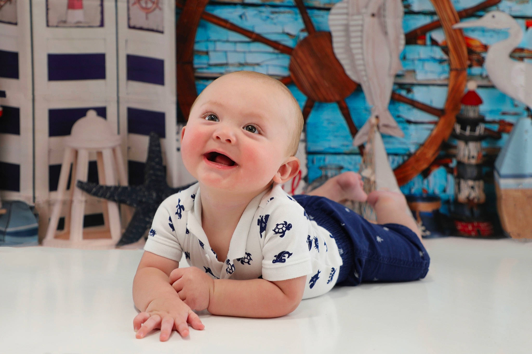Jalen is registered to the contest to win money with this photo: baby, baby_toddler_clothing, cheek, child, crawling, floor, flooring, fun, happy, hardwood, headwear, laugh, leisure, person, room, sitting, skin, sleeve, smile, t_shirt