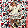 Nirahylez joined the competition — help win amazing prizes! adorable, baby, child, colorful, comfortable, cute, dress, fabric, floral_blanket, headband, indoors, infant, lying_down, mittens, patterned, portrait, shoes, small_person, socks, young_child