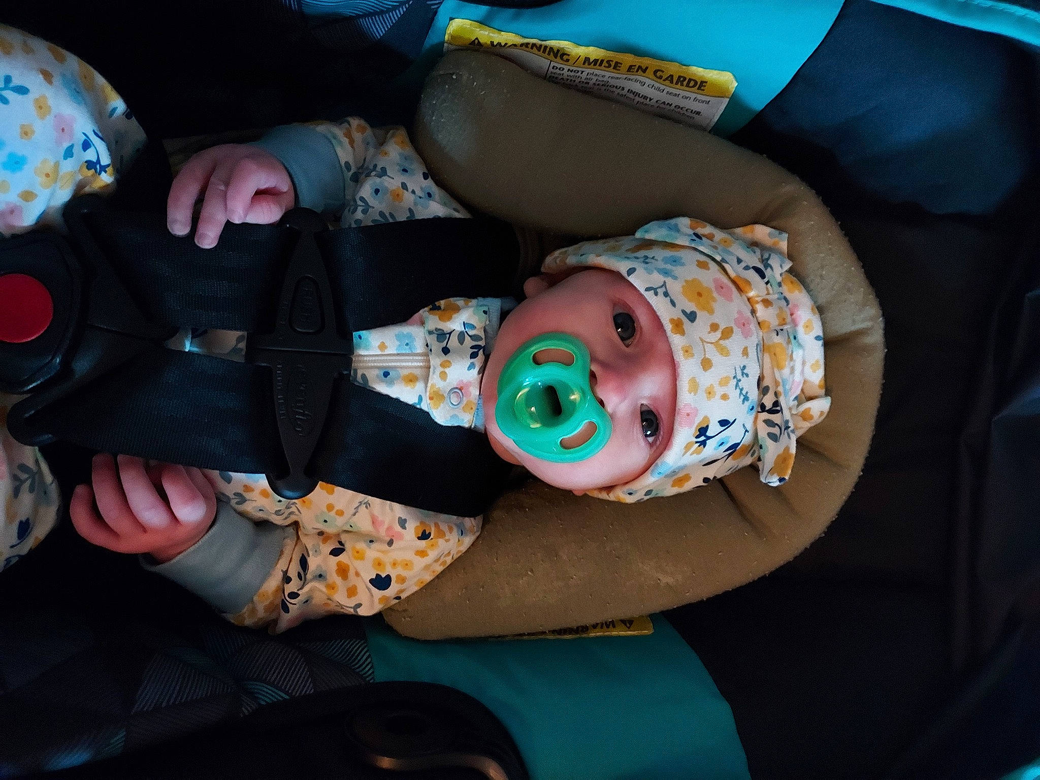 Briella is registered to the contest to win money with this photo: baby, baby_products, baby_toddler_clothing, car_seat, child, comfort, fun, headwear, human_body, lap, nail, pattern, person, smile, thigh, toddler, wrist