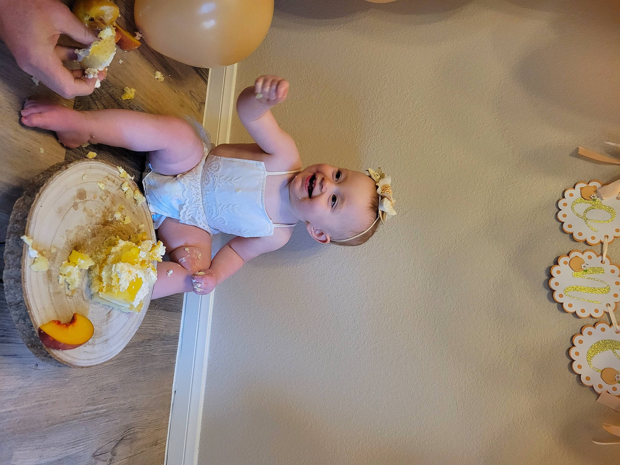 Clara joined the competition — help win amazing prizes! baby, balloon, child, circle, dress, event, fun, happy, joy, party, party_supply, person, platter, room, smile, tableware, toddler