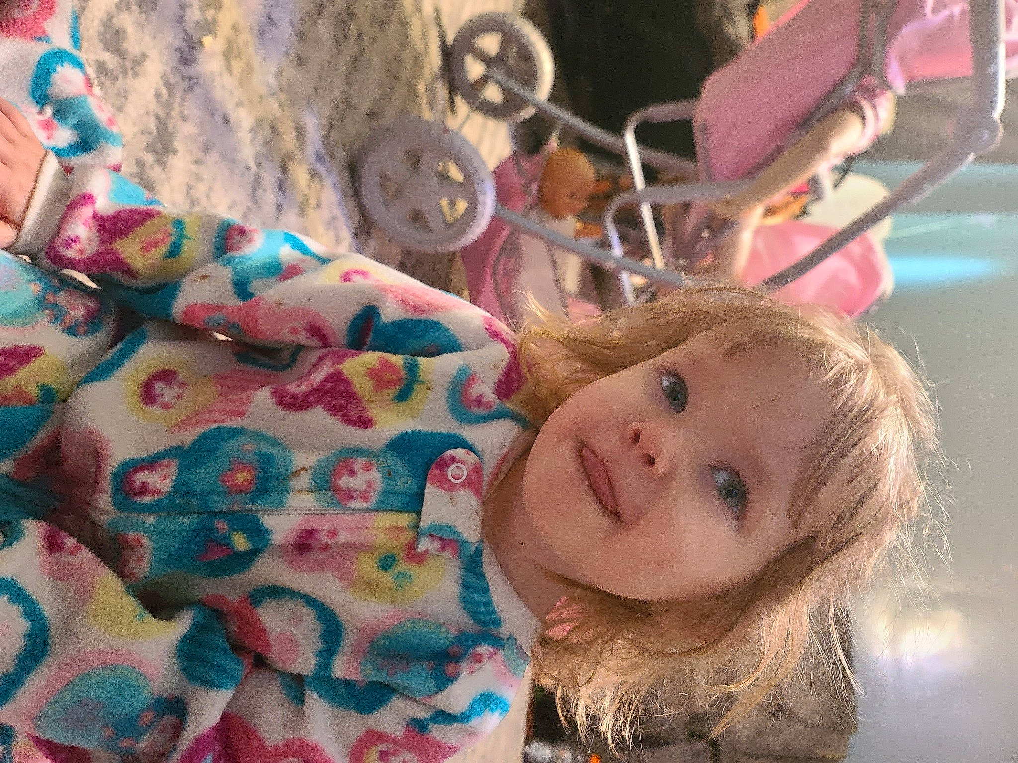 Ellainah is registered to the contest to win money with this photo: baby, brown_hair, cheek, child, eye, face, fun, happy, head, joy, leisure, linens, nose, pattern, person, pink, room, skin, smile, toddler