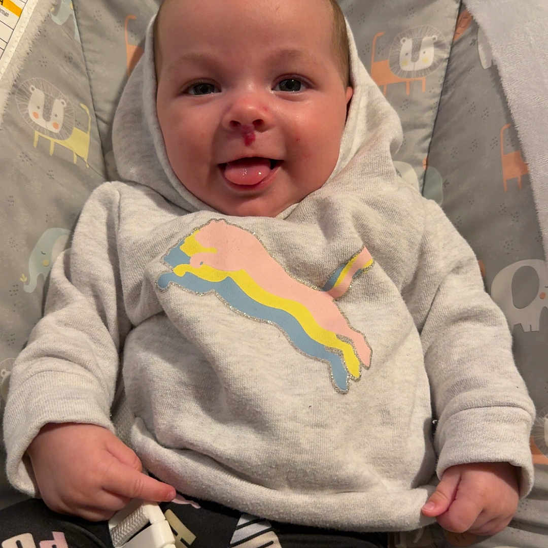 Harper joined the competition — help win amazing prizes! baby, bed, bodypart, clothing, cushion, face, finger, footwear, furniture, hand, head, homedecor, knitwear, newborn, pants, person, photography, portrait, sweater, t_shirt