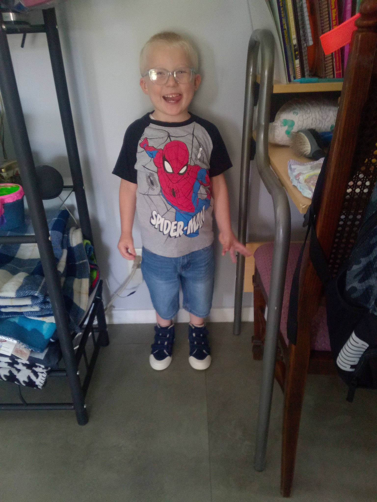 Blane joined the competition — help win amazing prizes! baby_toddler_clothing, child, denim, electric_blue, eyewear, floor, flooring, fun, hardwood, human_leg, knee, major_appliance, person, room, shelf, shelving, shorts, smile, standing, t_shirt