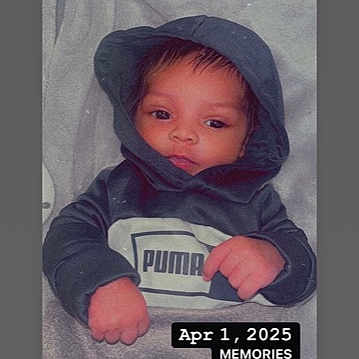 Zymere Lasanta is registered to the contest to win money with this photo: baby, blanket, child, clothing, cozy, cute, expression, face, hands, hoodie, indoors, infant, lying_down, portrait, puma, resting, sleeves, soft, wrapped, young