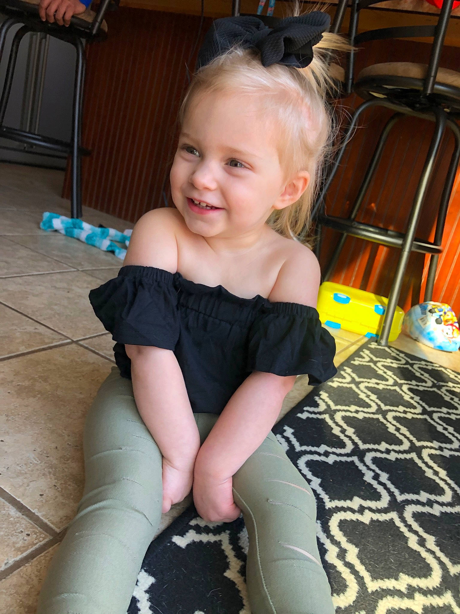 Nora is registered to the contest to win money with this photo: child, joy, leg, person, smile, toddler