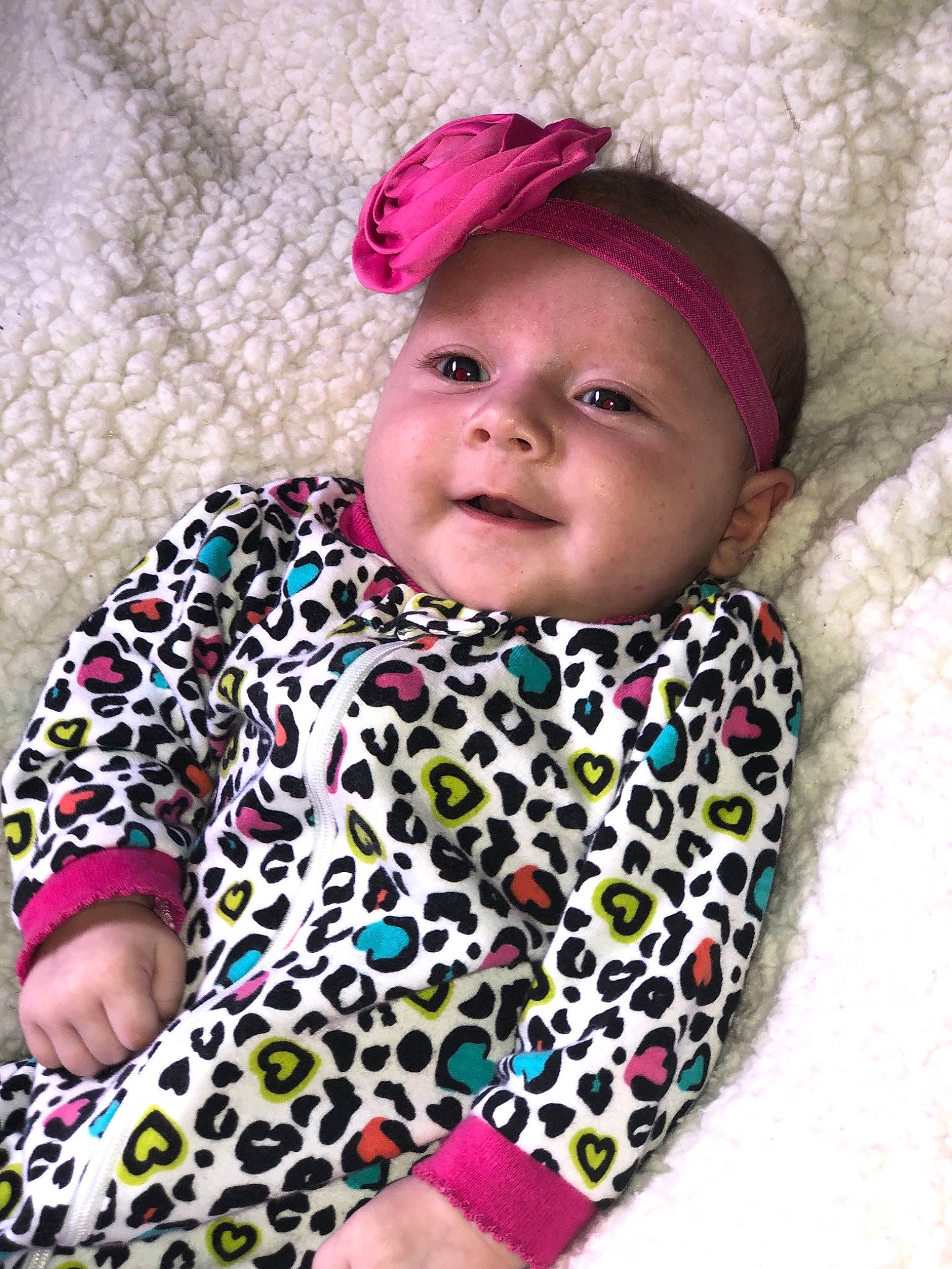 Maisyn is registered to the contest to win money with this photo: baby, baby_products, baby_toddler_clothing, cheek, child, hair_accessory, head, headband, headgear, pattern, person, pink, product, smile, toddler